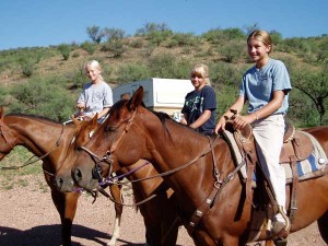 girls riding horses