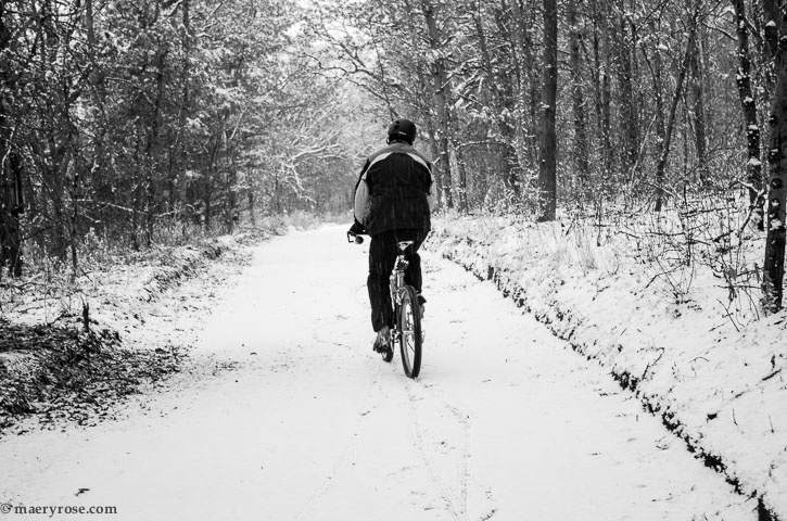 bicycling on snowy path