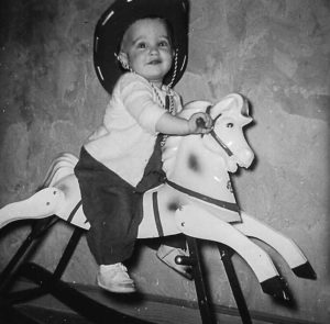 child on a rocking horse
