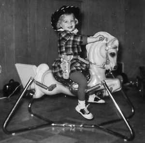 child on bouncy horse