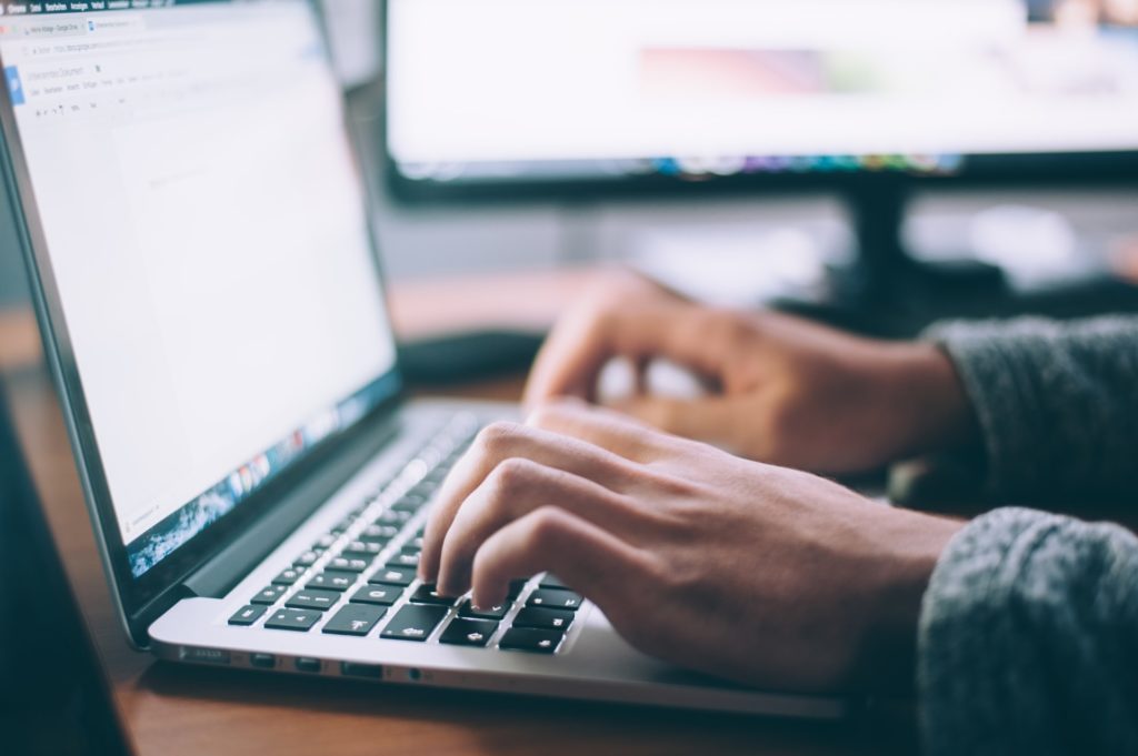 woman typing on computer